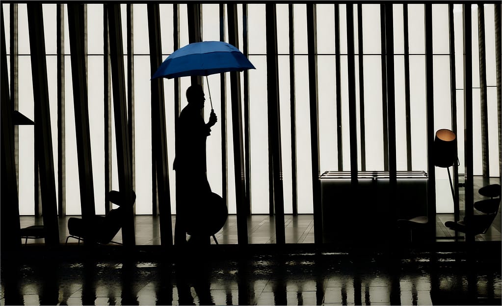 21 MAN WITH A BLUE UMBRELLA by Richard Burt